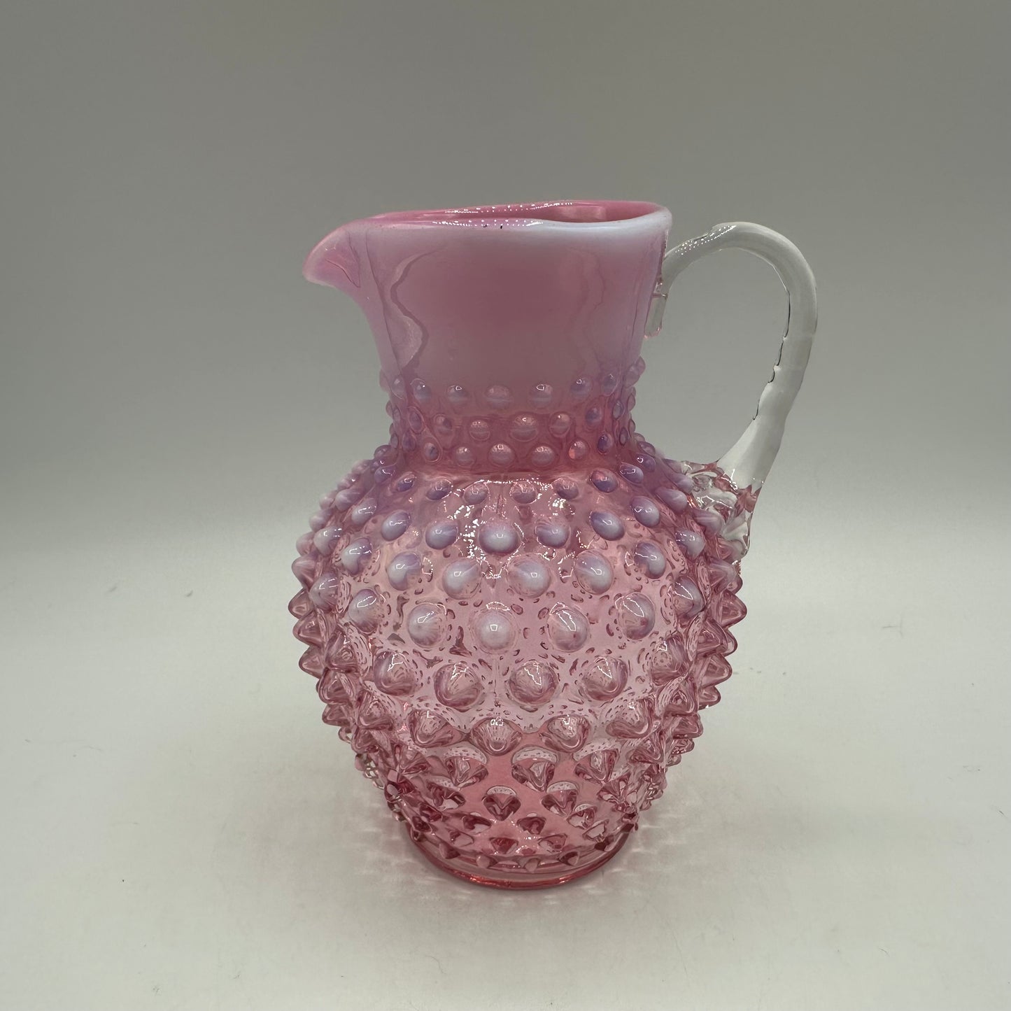 Fenton Cranberry Opalescent Hobnail Pitcher, 5.75"