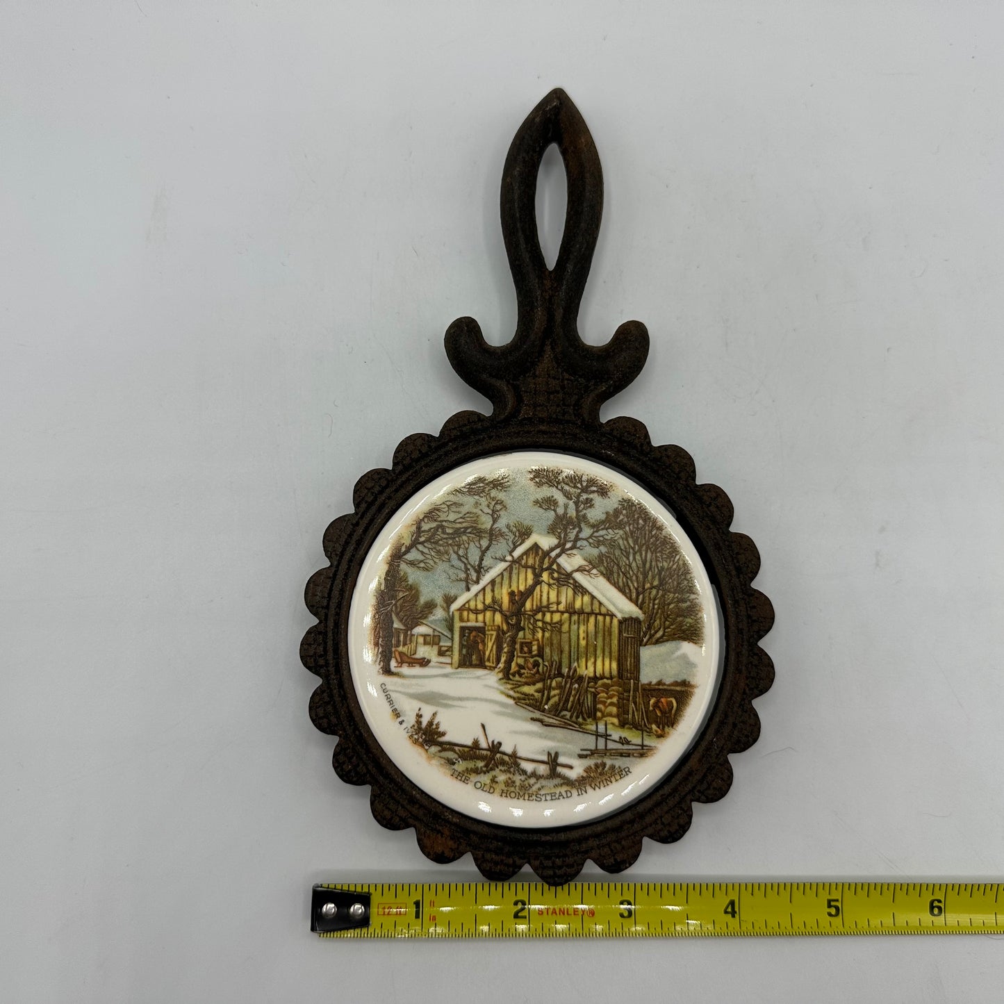 Currier and Ives Cast Iron Footed Trivet