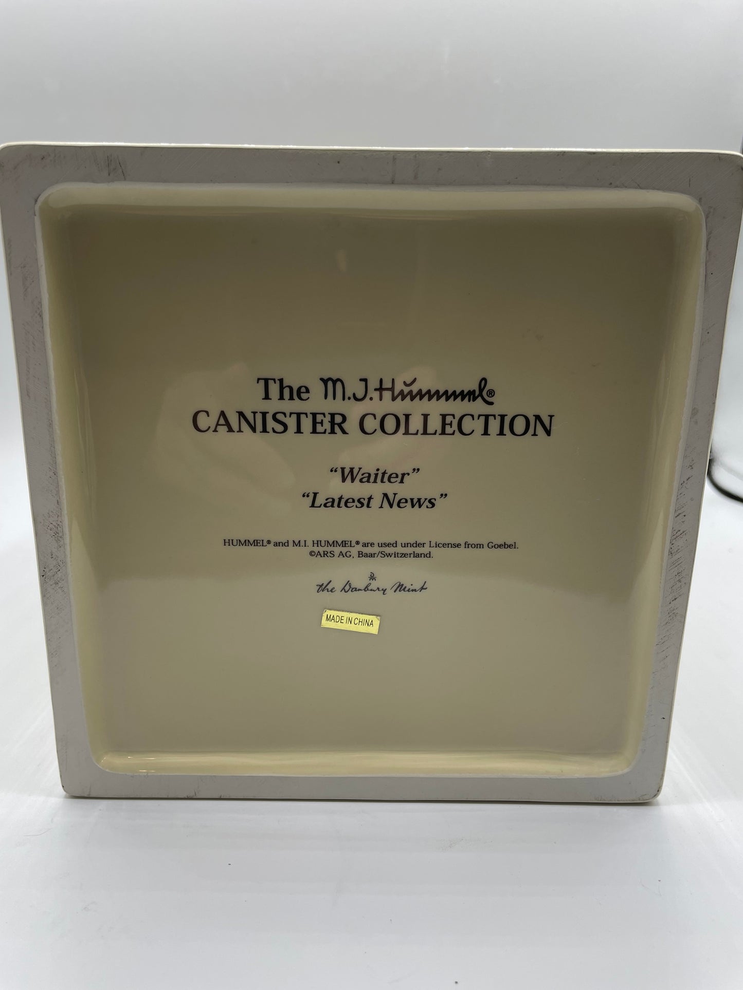 M.J. Hummel Square Canister “Waiter, Latest News”