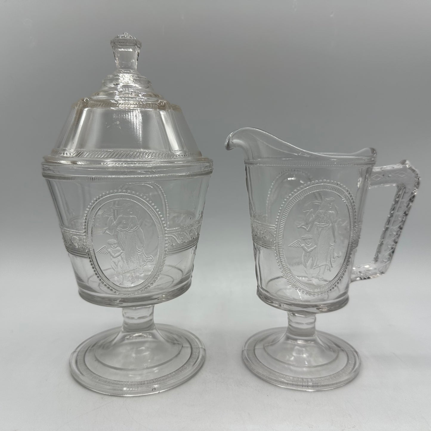 Richards & Hartley Glass Company Cupid & Venus Lidded Sugar Bowl & Creamer