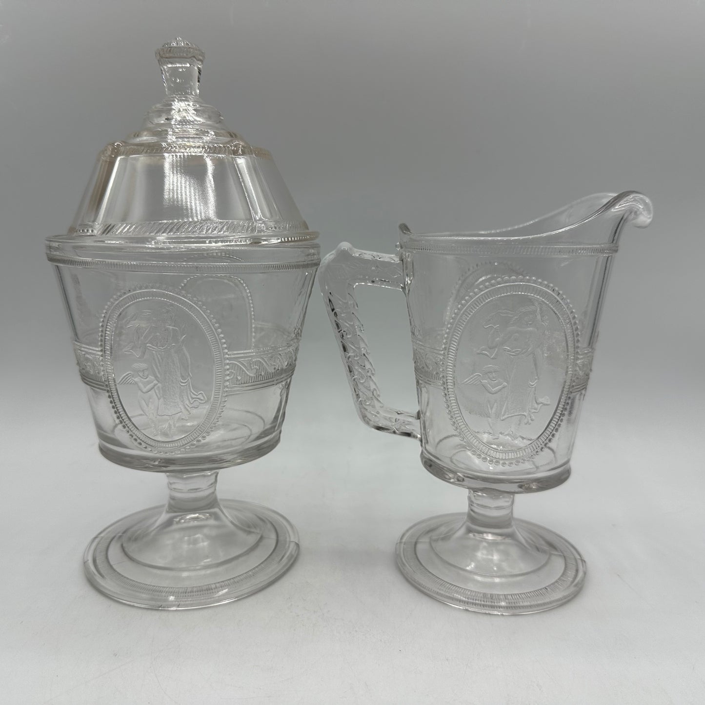 Richards & Hartley Glass Company Cupid & Venus Lidded Sugar Bowl & Creamer