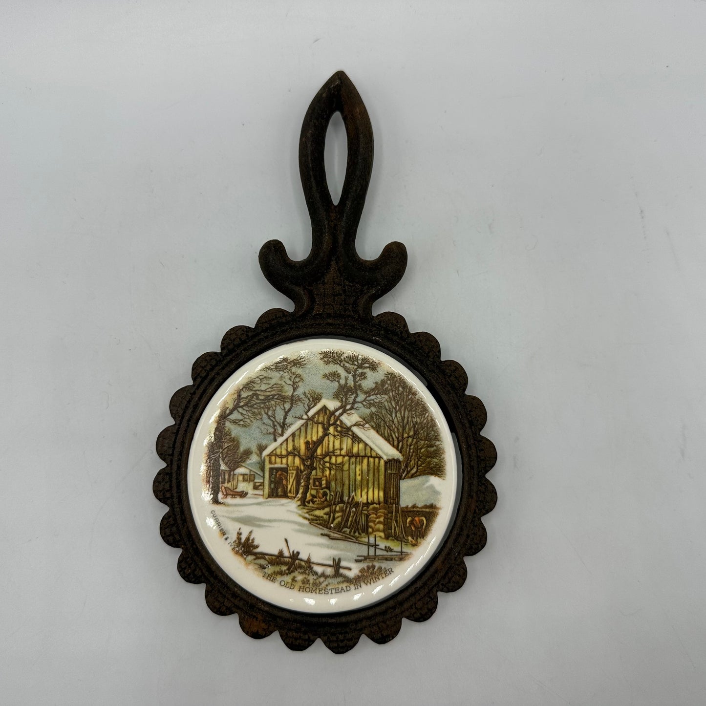 Currier and Ives Cast Iron Footed Trivet