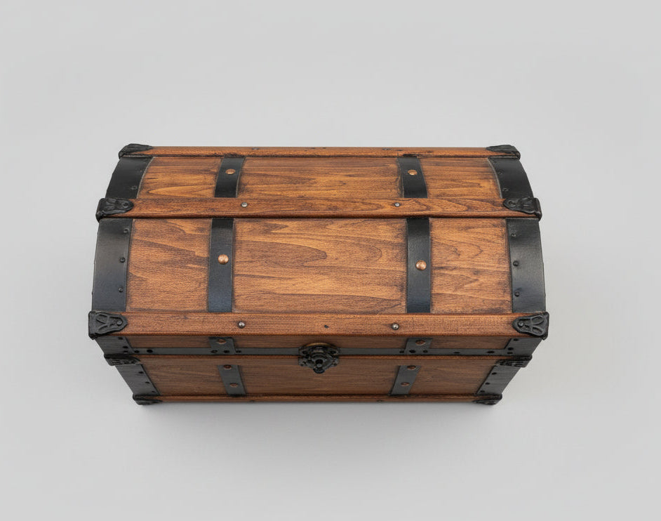 Wooden trunk with metal straps on a tiled floor