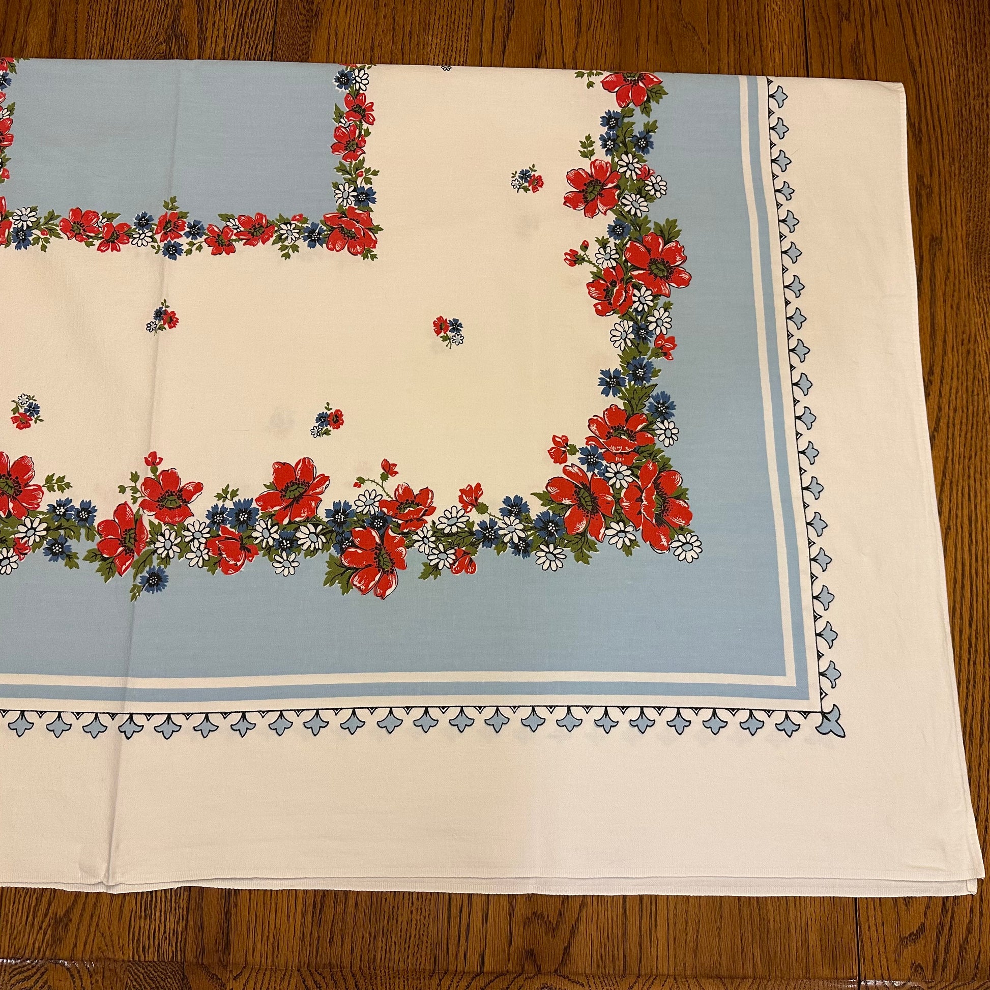 Floral patterned tablecloth on a wooden surface