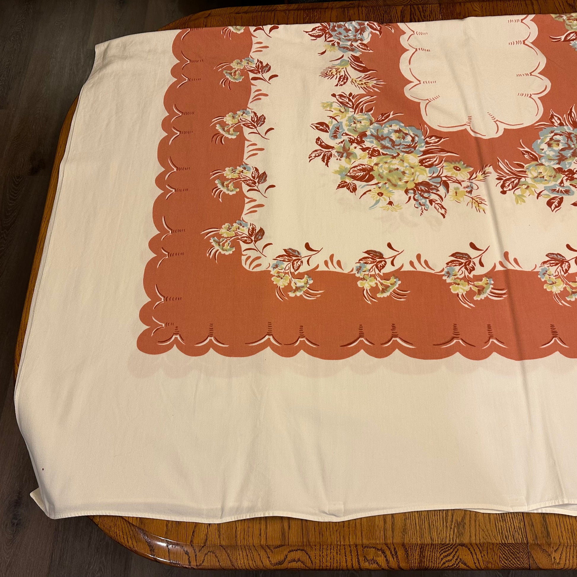 Floral patterned tablecloth on a wooden surface