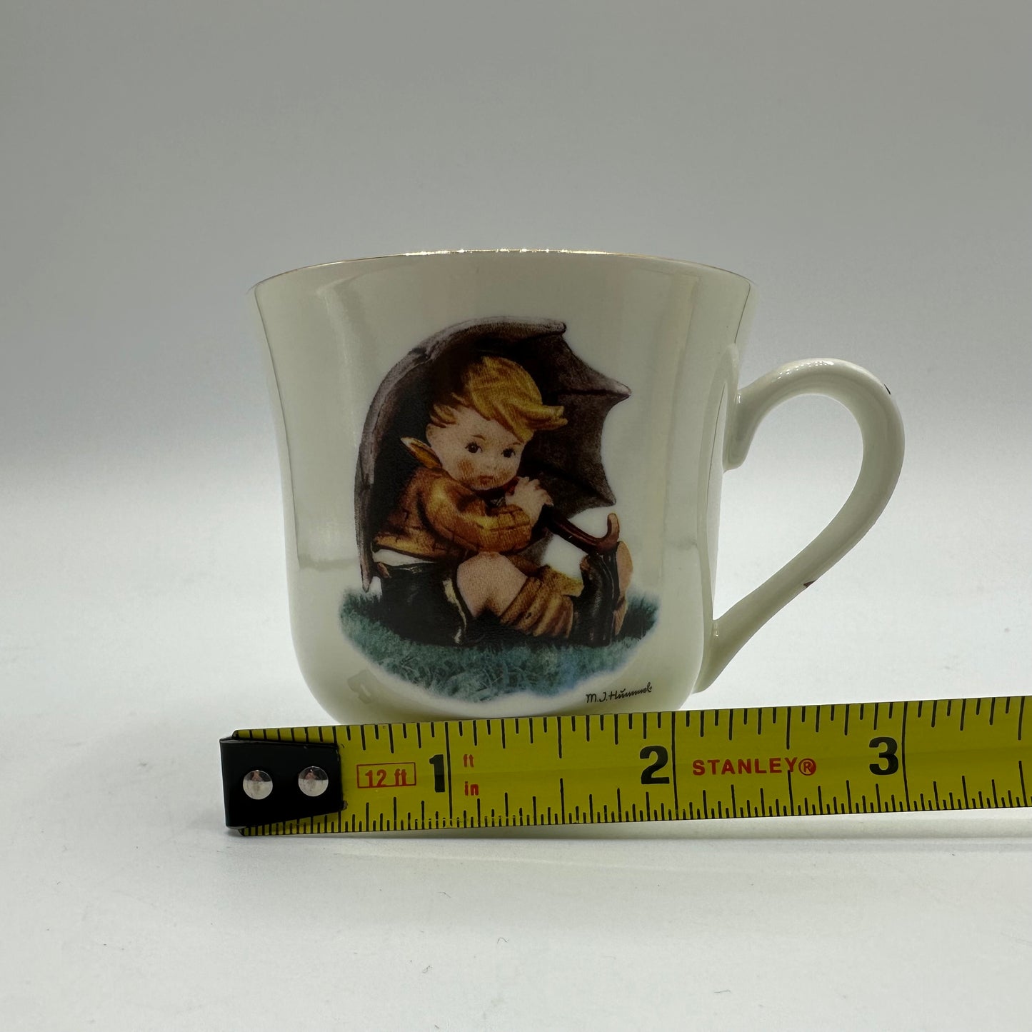 M.J. Hummel "Umbrella Boy" Cup and Saucer