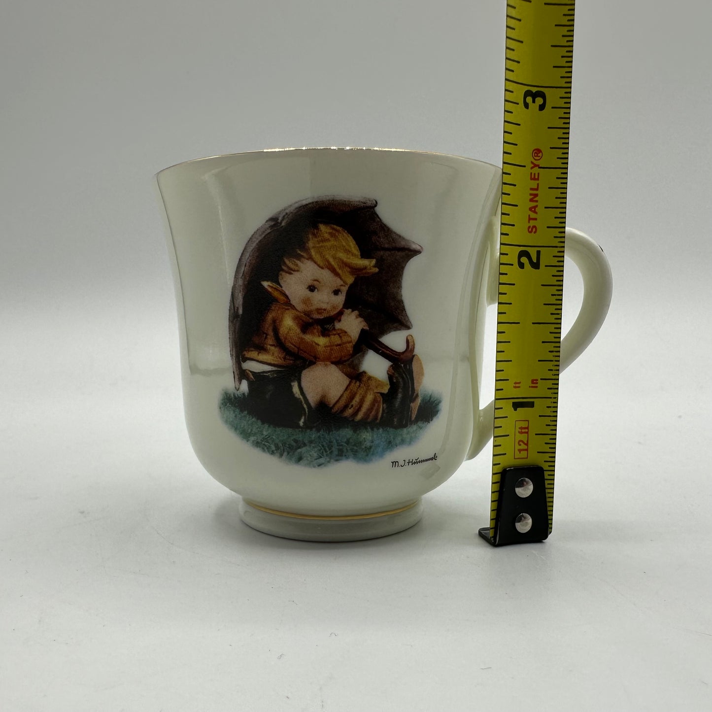 M.J. Hummel "Umbrella Boy" Cup and Saucer