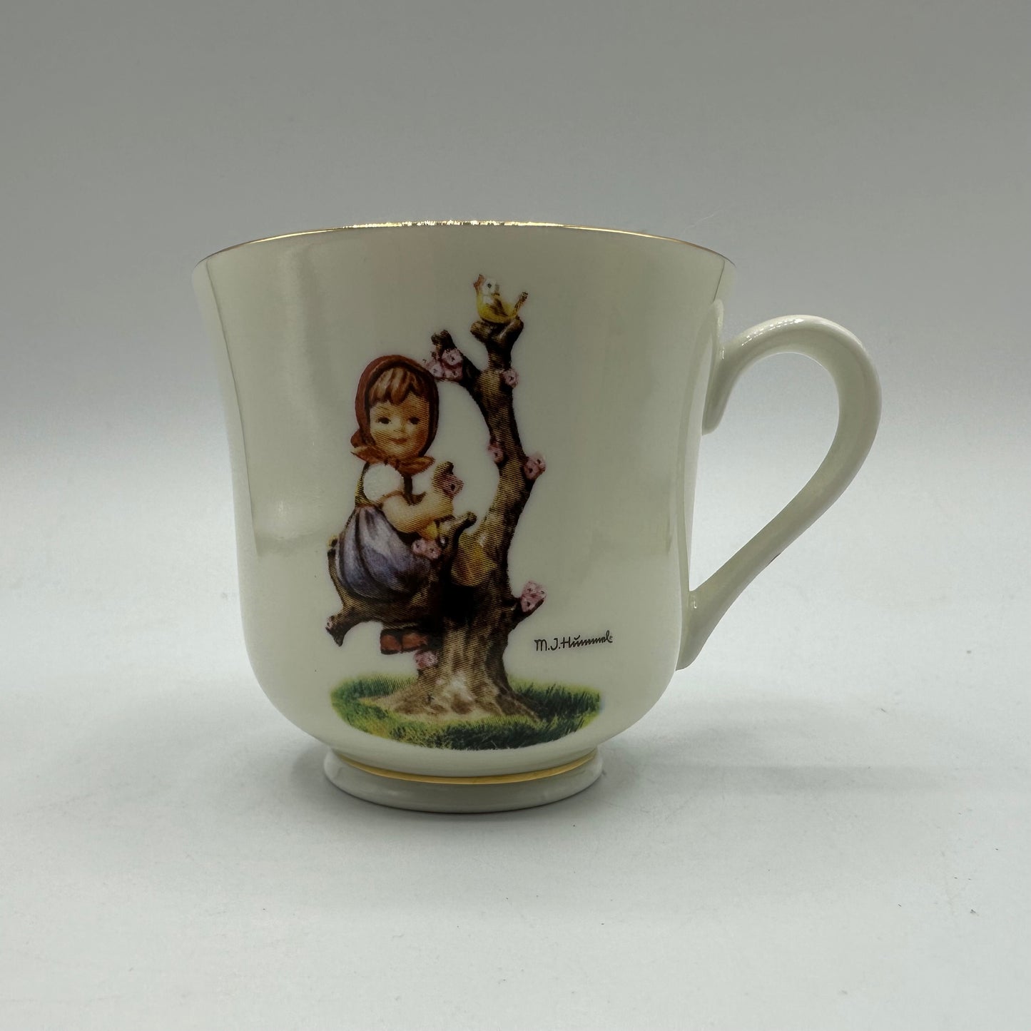 M.J. Hummel "Apple Tree Girl" Cup and Saucer