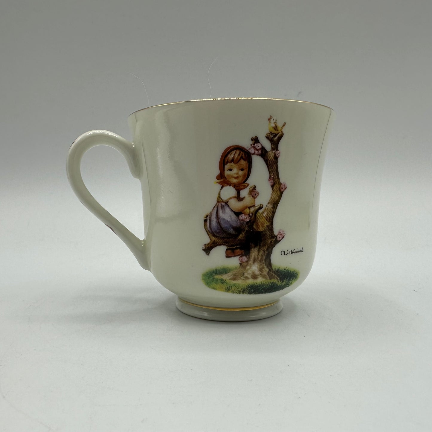 M.J. Hummel "Apple Tree Girl" Cup and Saucer