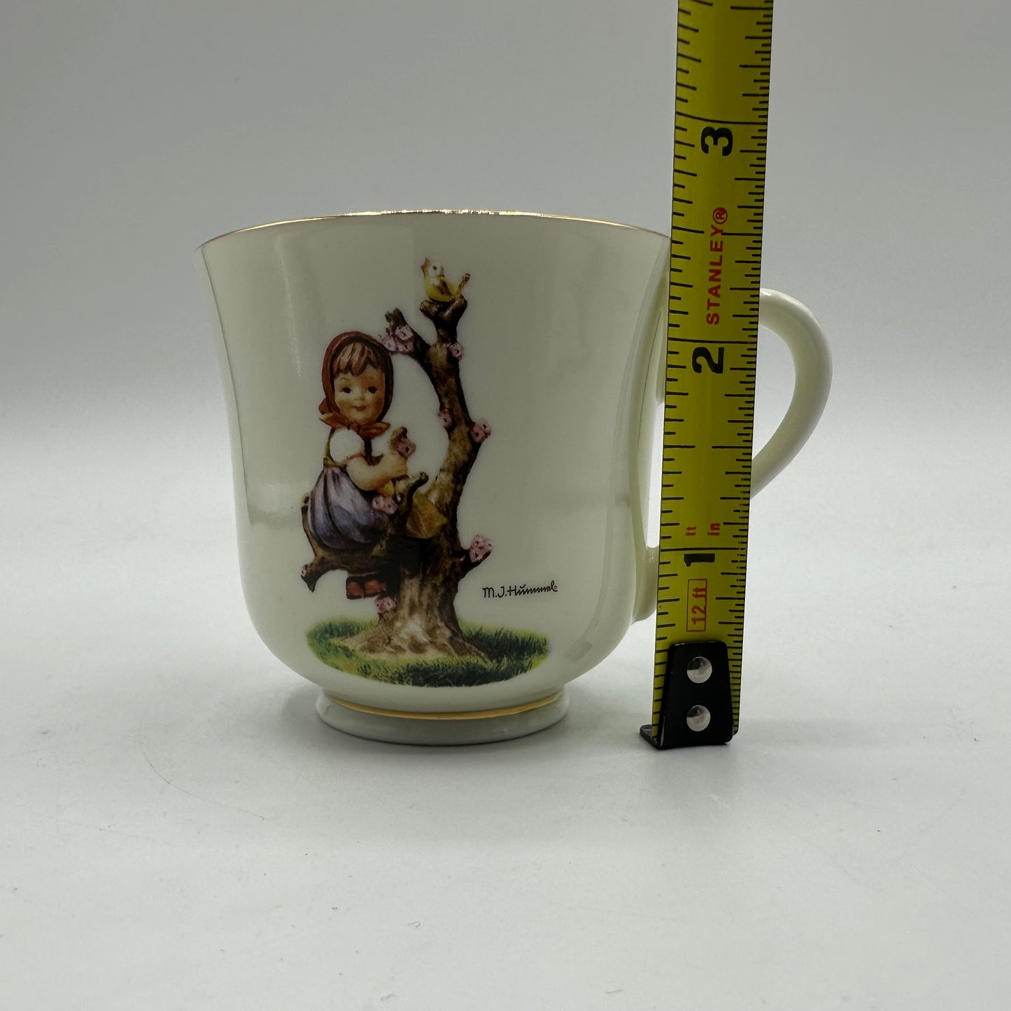 M.J. Hummel "Apple Tree Girl" Cup and Saucer