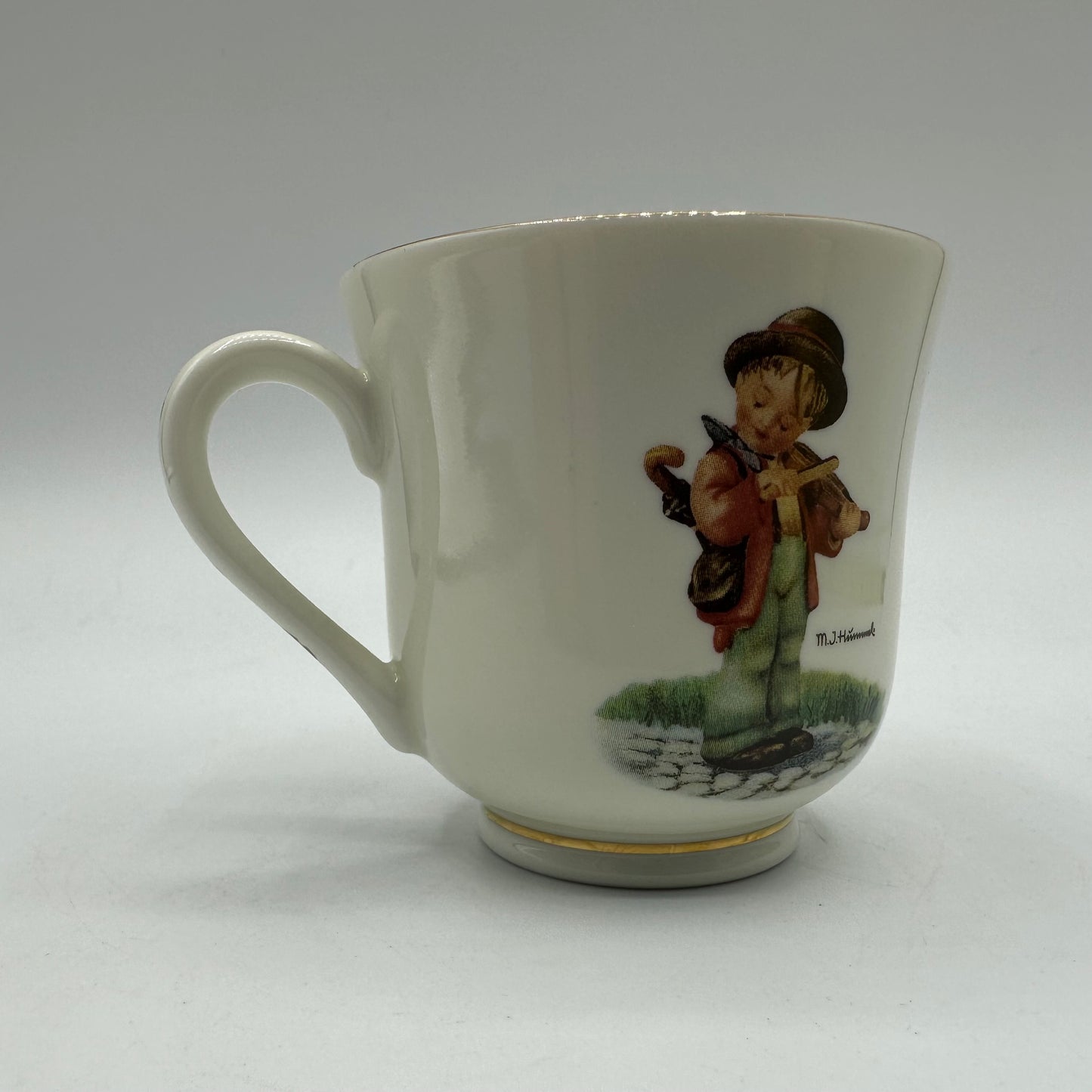 M.J. Hummel "Little Fiddler" Cup and Saucer