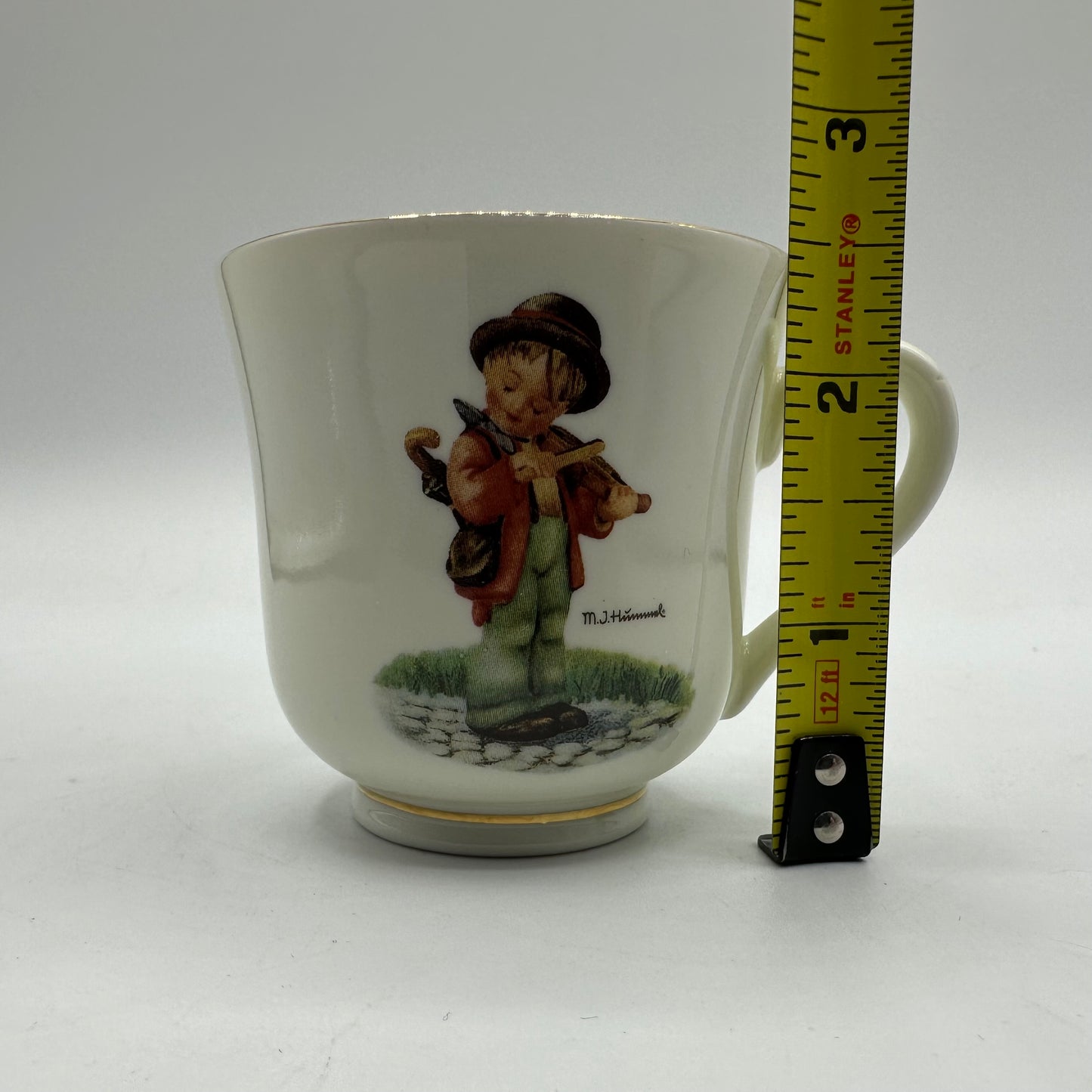 M.J. Hummel "Little Fiddler" Cup and Saucer