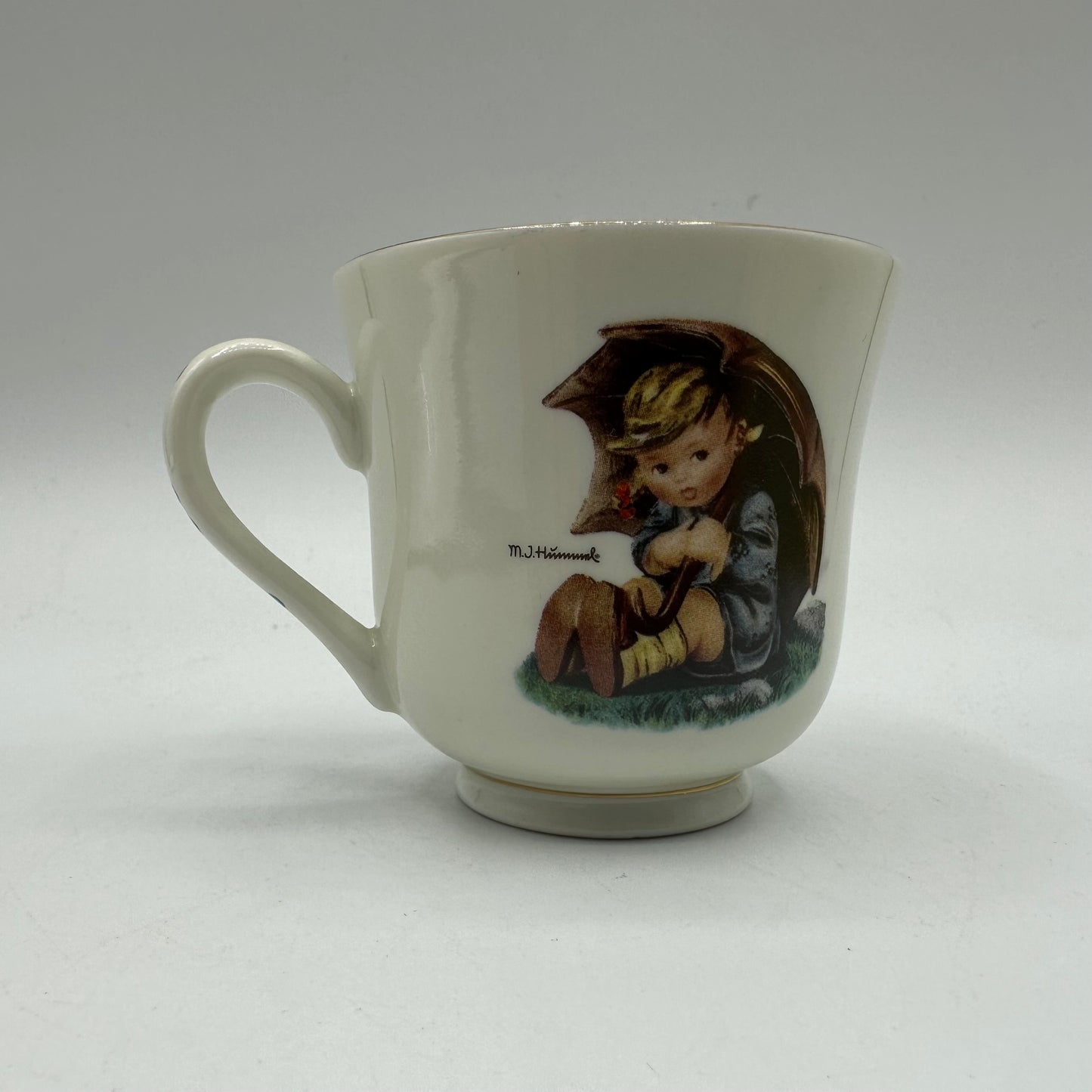 M.J. Hummel "Umbrella Girl" Cup and Saucer