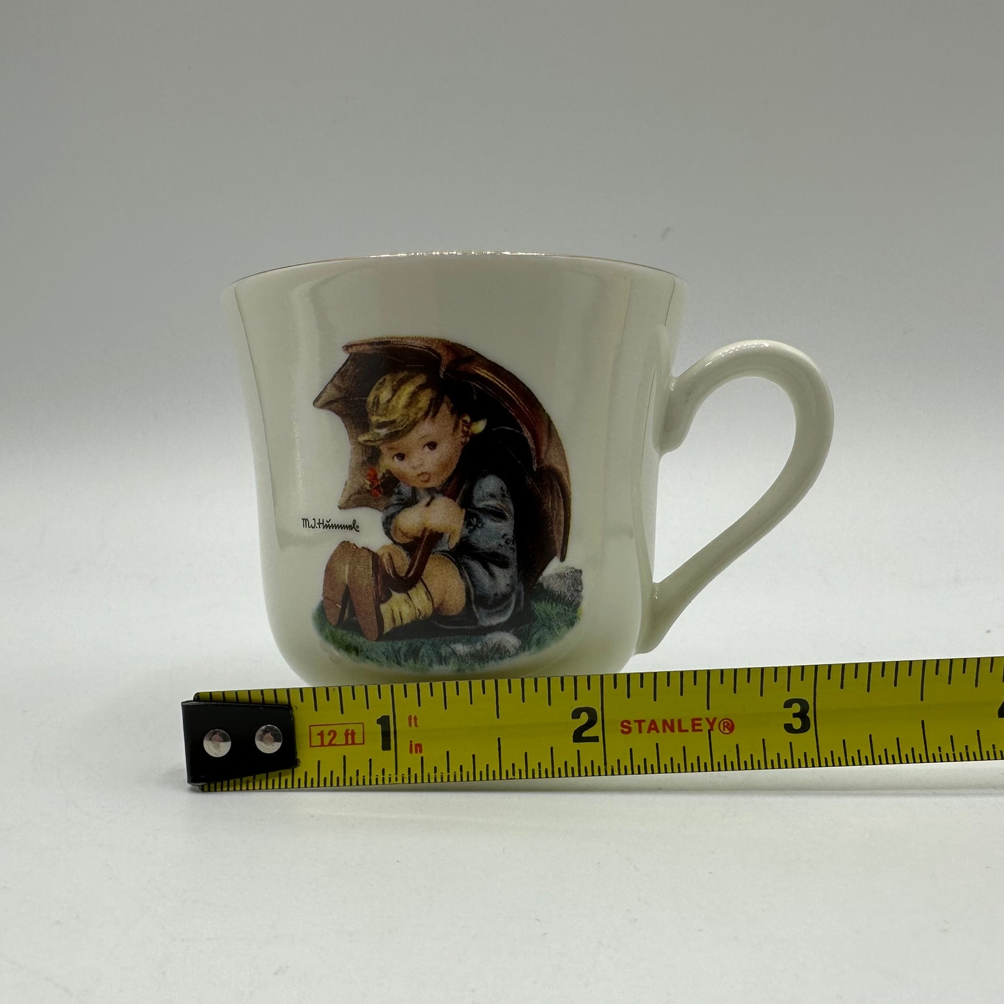 M.J. Hummel "Umbrella Girl" Cup and Saucer