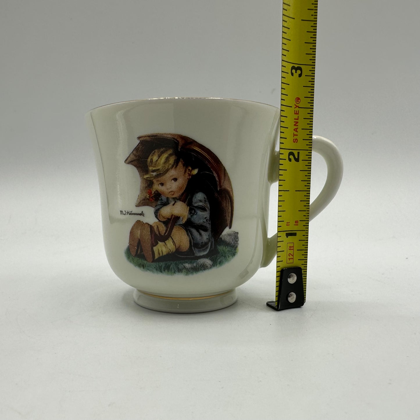 M.J. Hummel "Umbrella Girl" Cup and Saucer