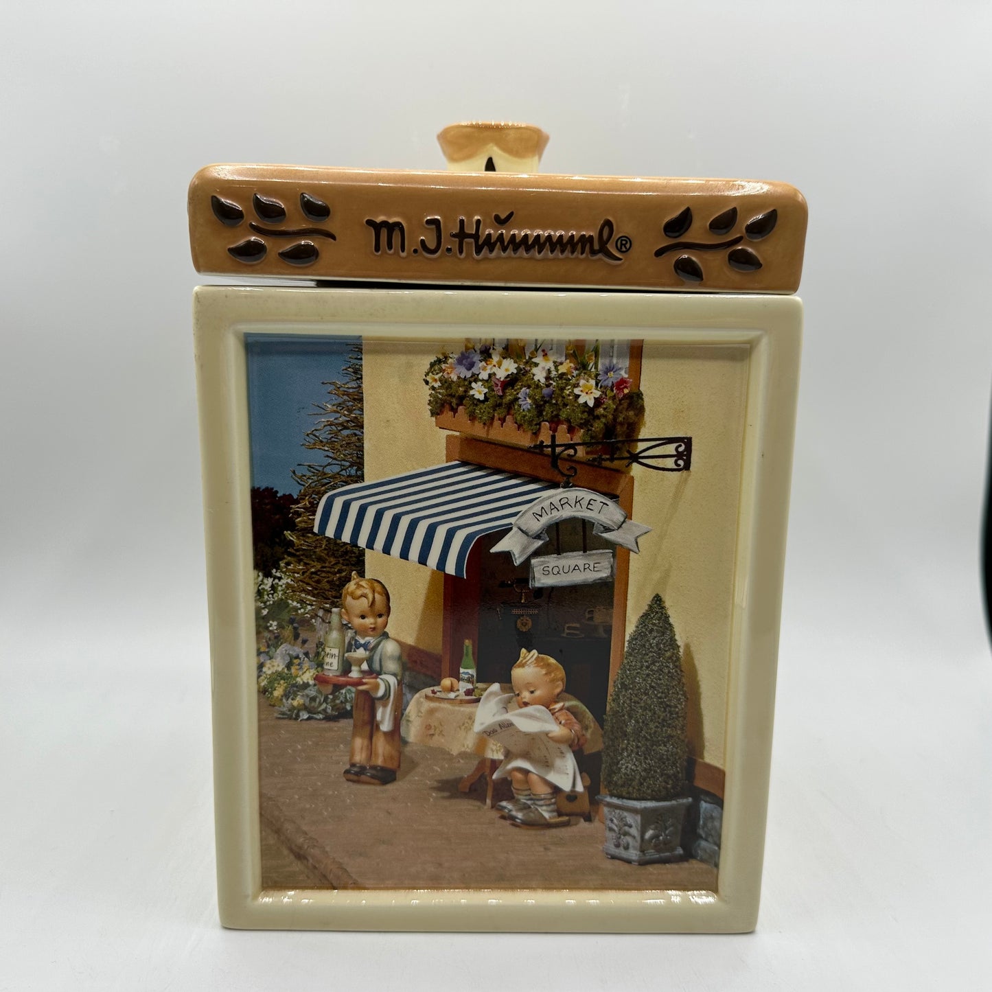 M.J. Hummel Square Canister “Waiter, Latest News”