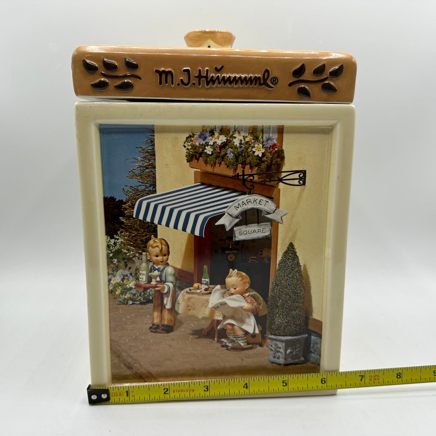 M.J. Hummel Square Canister “Waiter, Latest News”